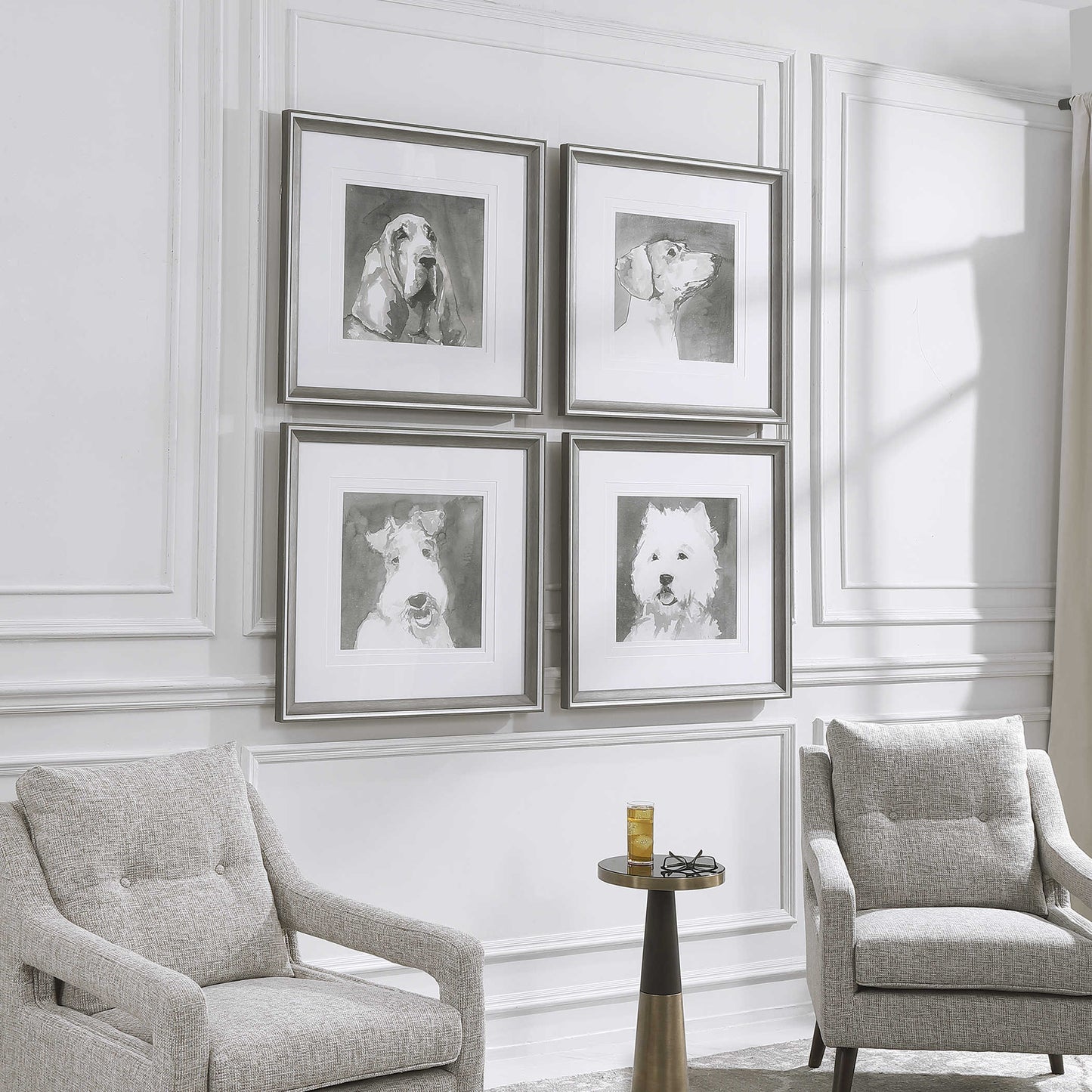 Angled view of an upscale, contemporary living room with two decorative arm chairs and a set of dog art.