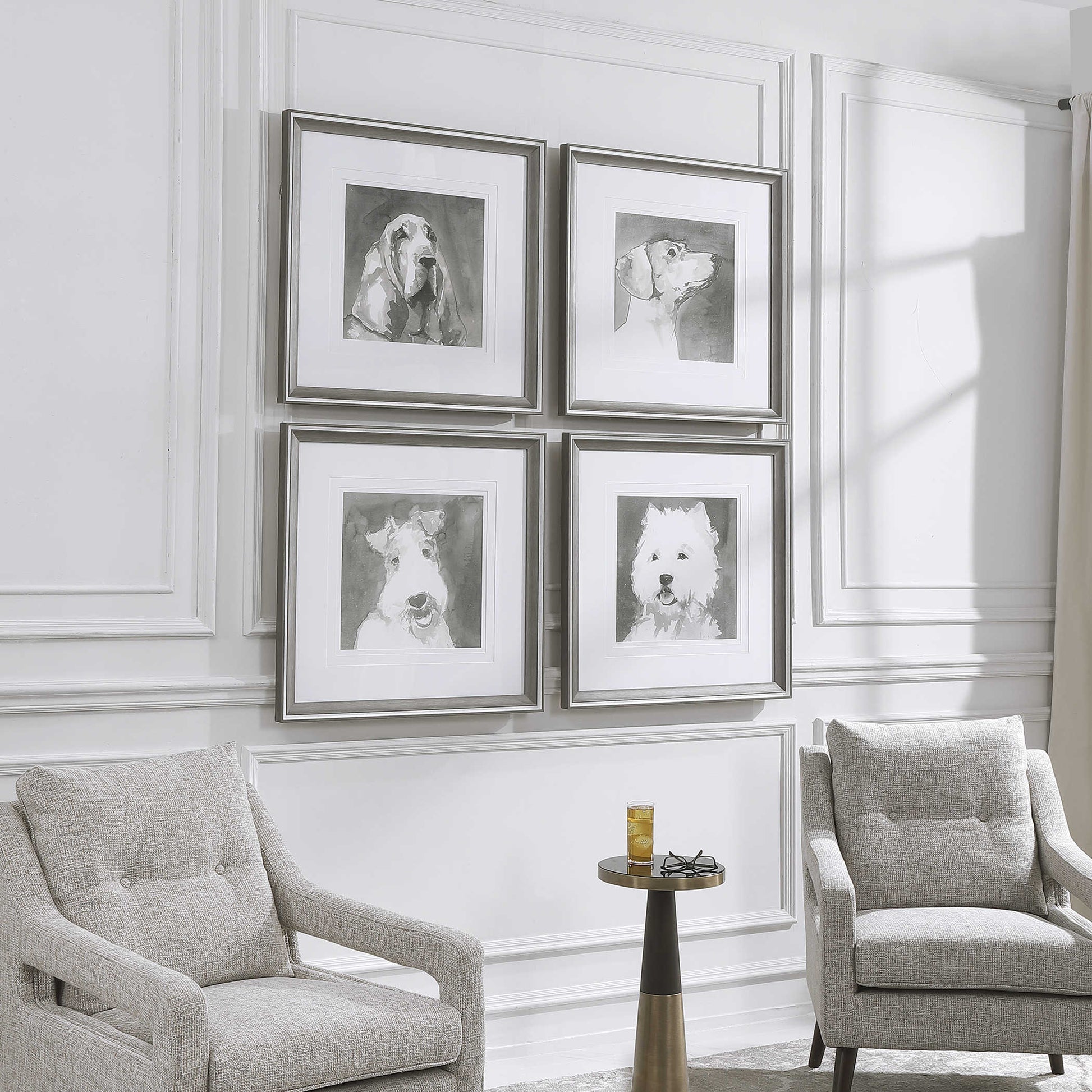 Angled view of an upscale, contemporary living room with two decorative arm chairs and a set of dog art.
