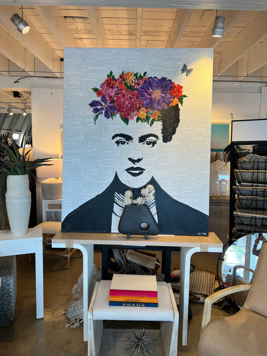 Local artist. Freda with flowers on head, face features overlay fine newspaper print.