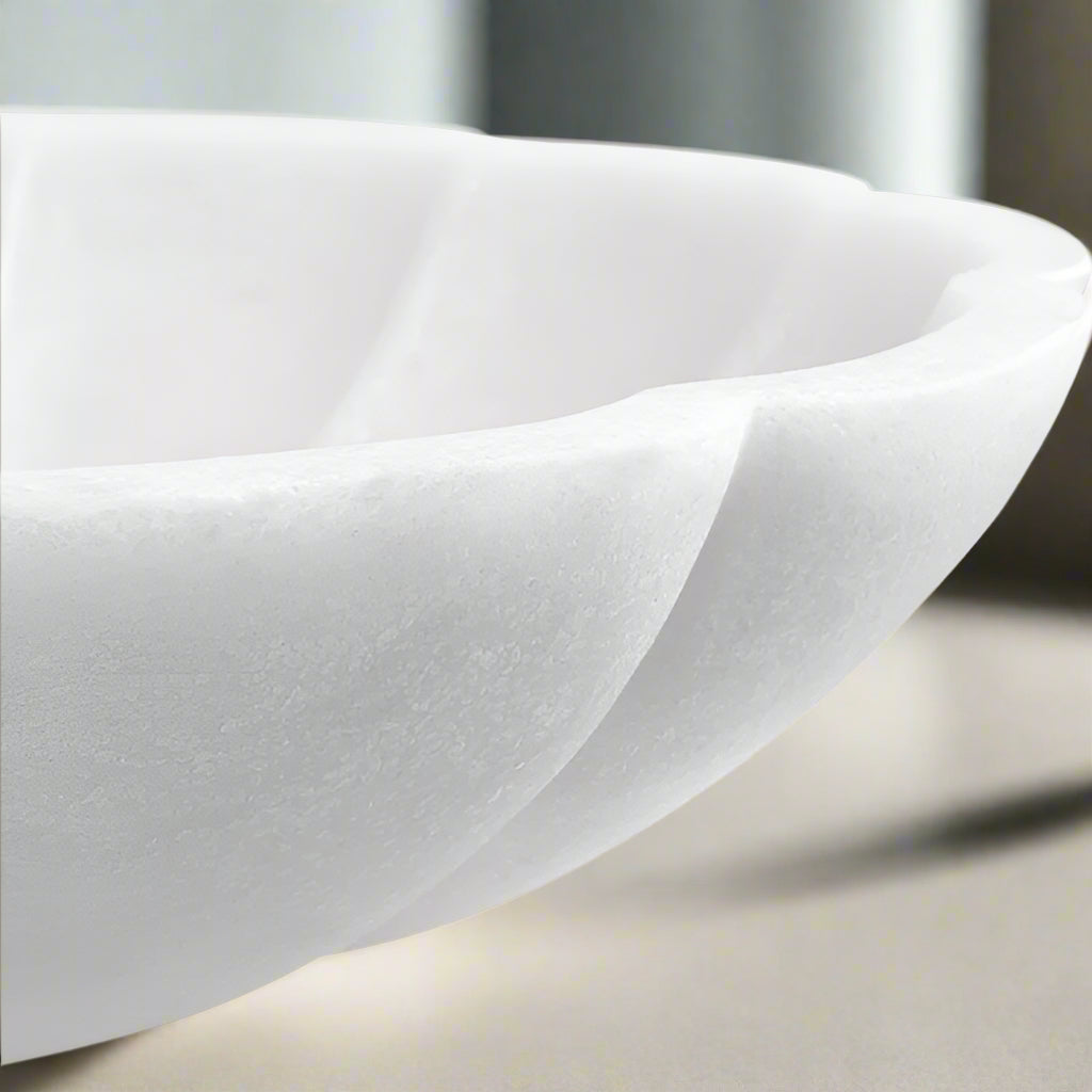 Close up image of texture of curved white bowl.