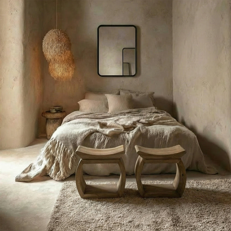 Warm bedroom with wood stools and lime wash walls