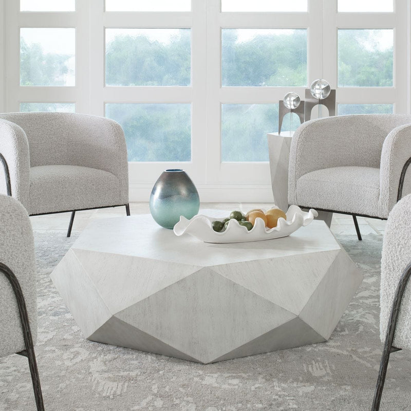 White geometric coastal coffee table in living room.