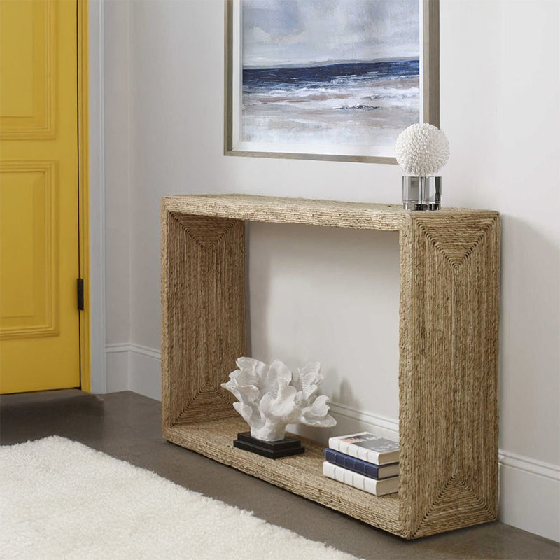 Entry way console table with coastal accents and coral and ocean painting.