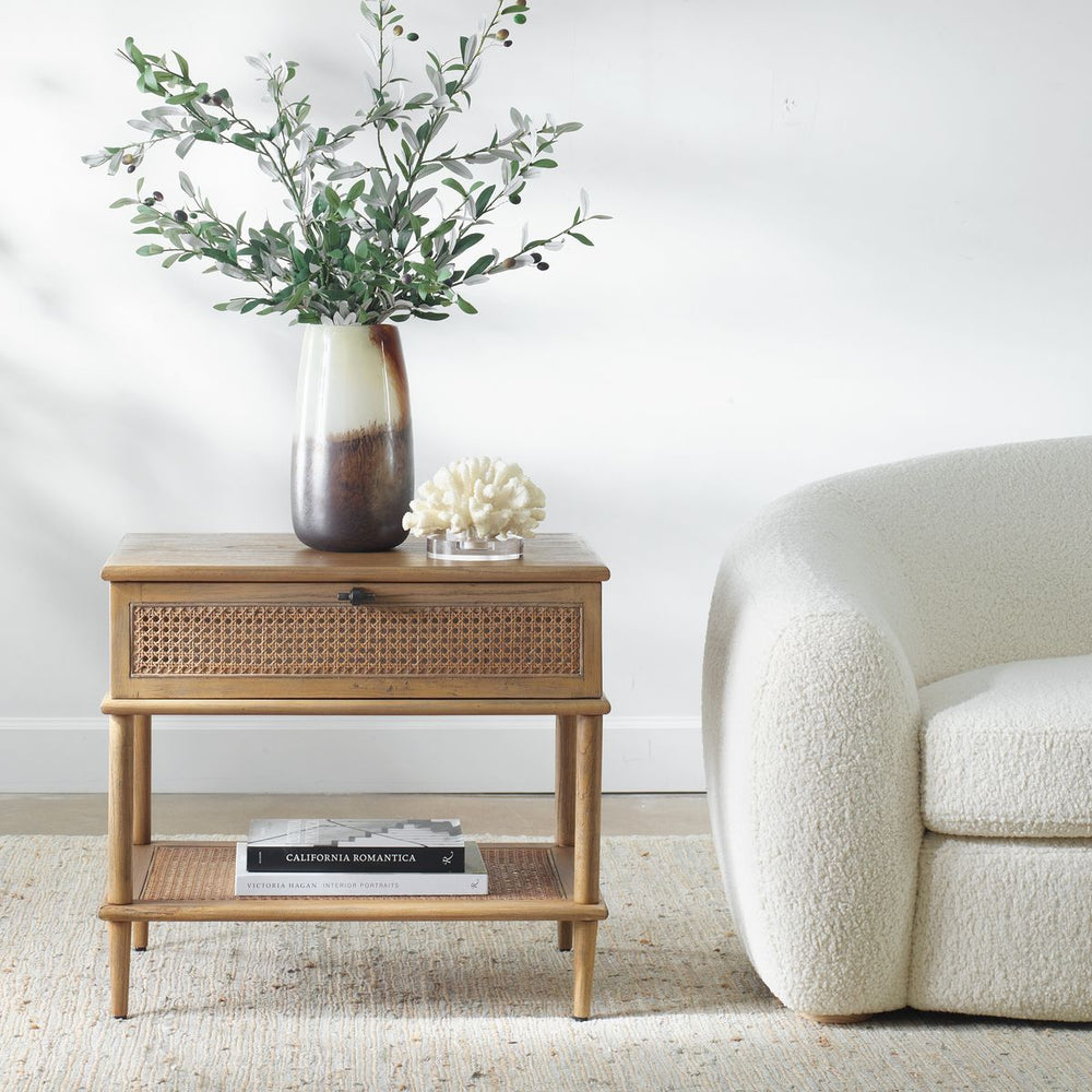 Coastal end table with vase and plant.