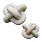 Limestone link sculptures styled on a coffee table