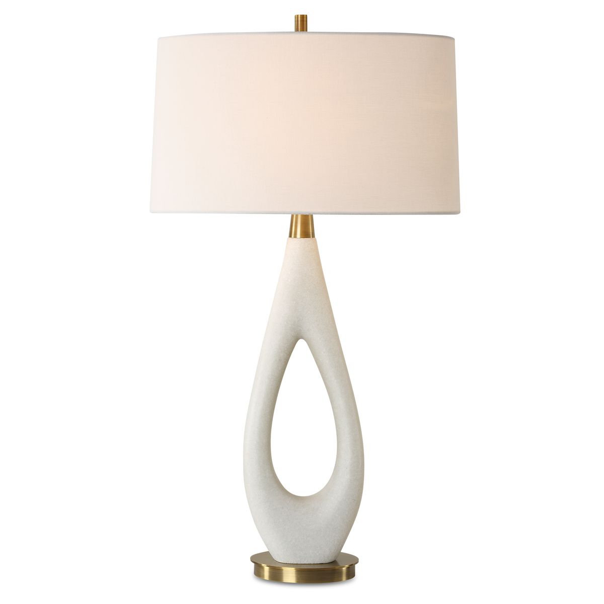 Table lamp with a white ceramic base and beige lampshade on a white background