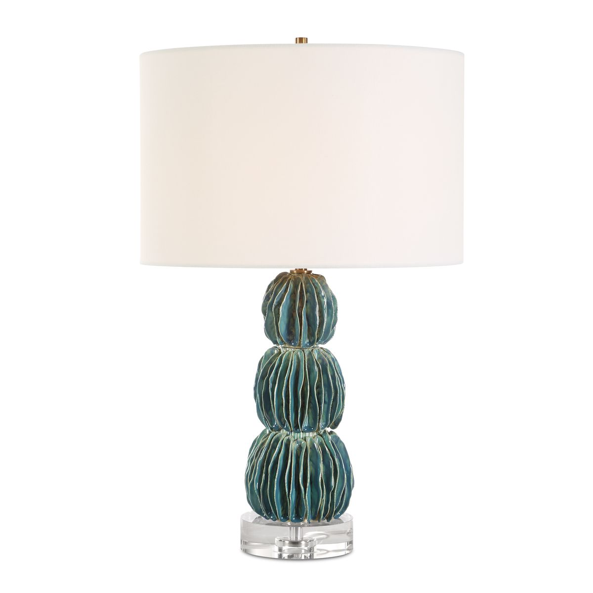 Table lamp with a textured blue base and white shade on a white background