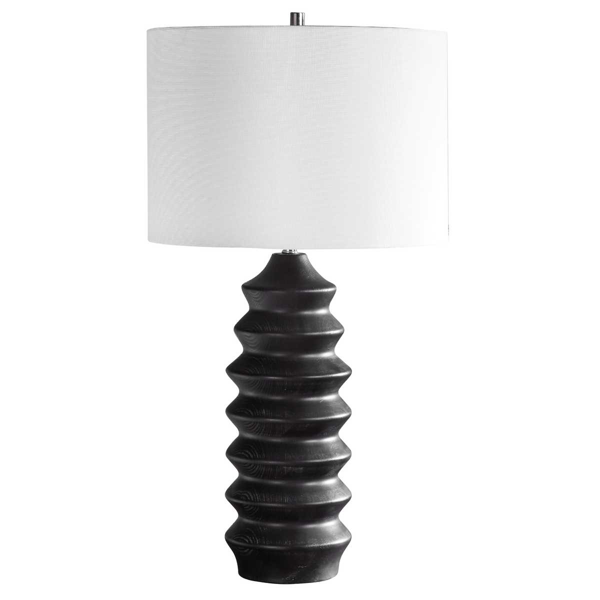 Table lamp with textured black base and white shade on a white background