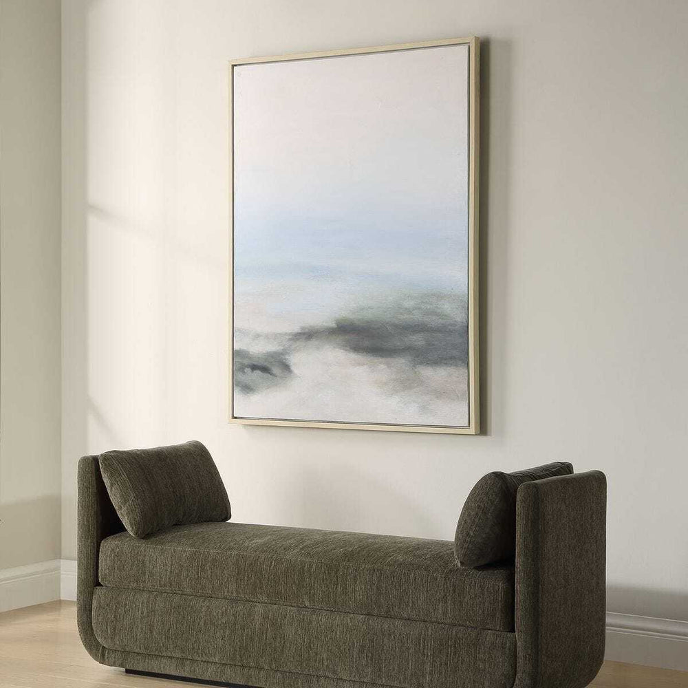 Gray sofa in a room with a large abstract painting on the wall.