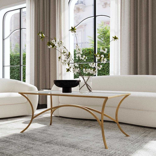 Glass coffee table with gold metal frame on a white background