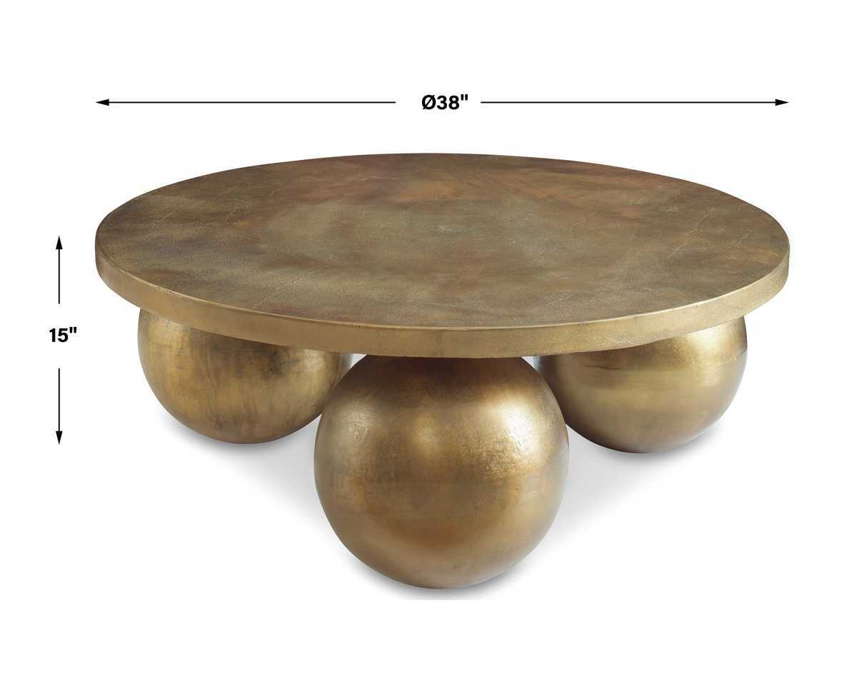 Gold round coffee table with spherical bases and dimensions on a white background