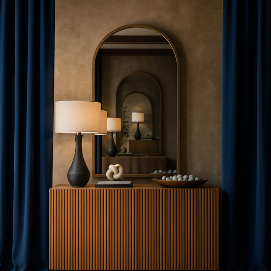 Wooden console table with decorative items, lamp, and mirror in a room setting.