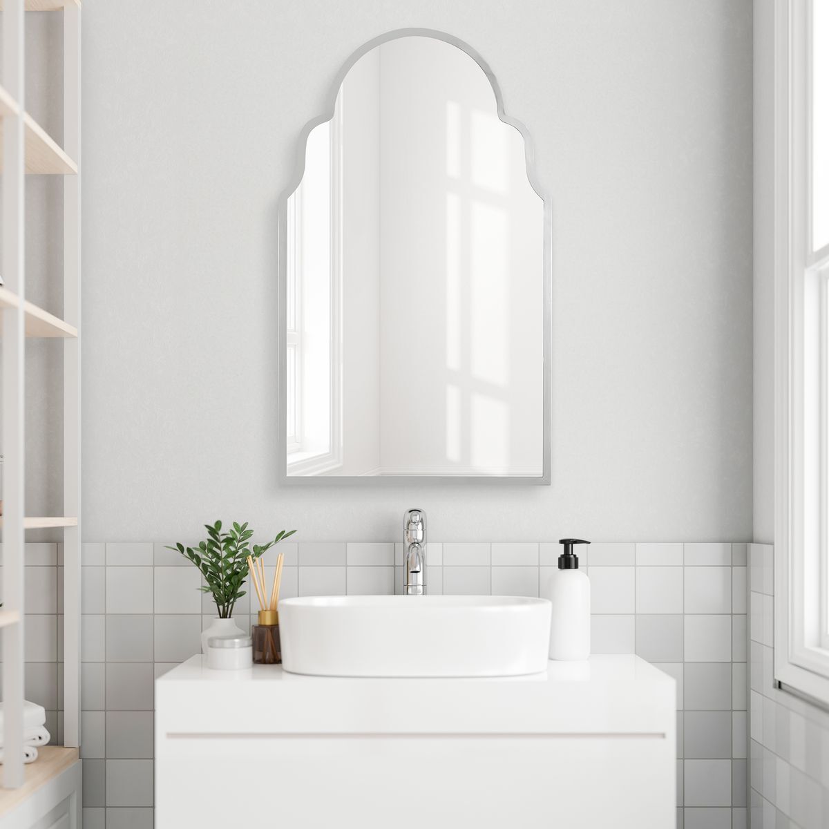 Arched polished nickel bathroom vanity mirror.