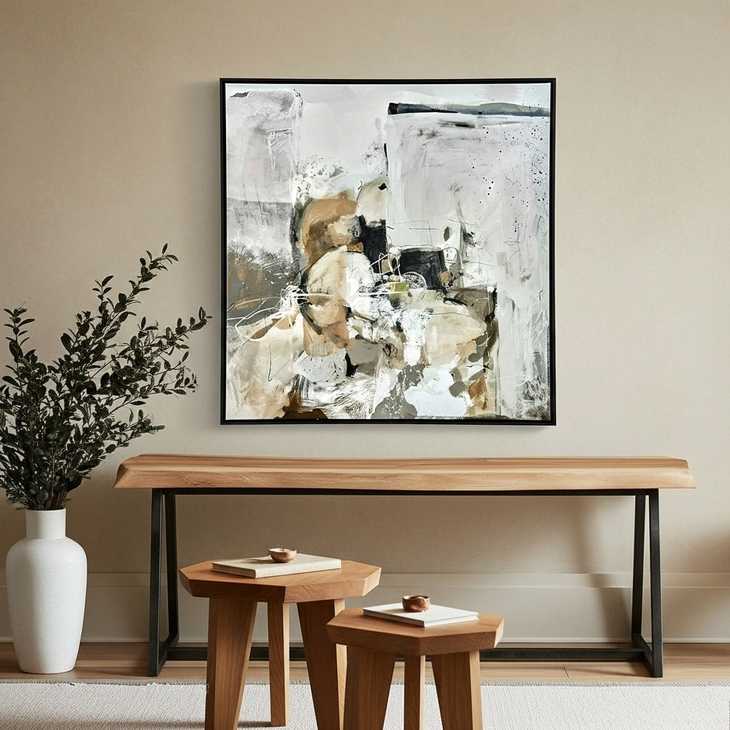 Abstract painting on a wall above a wooden console table with decorative items.