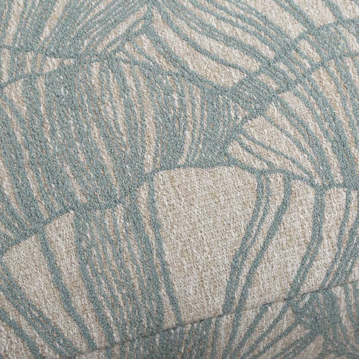 Close-up of a textured fabric with a geometric pattern in shades of blue and beige.