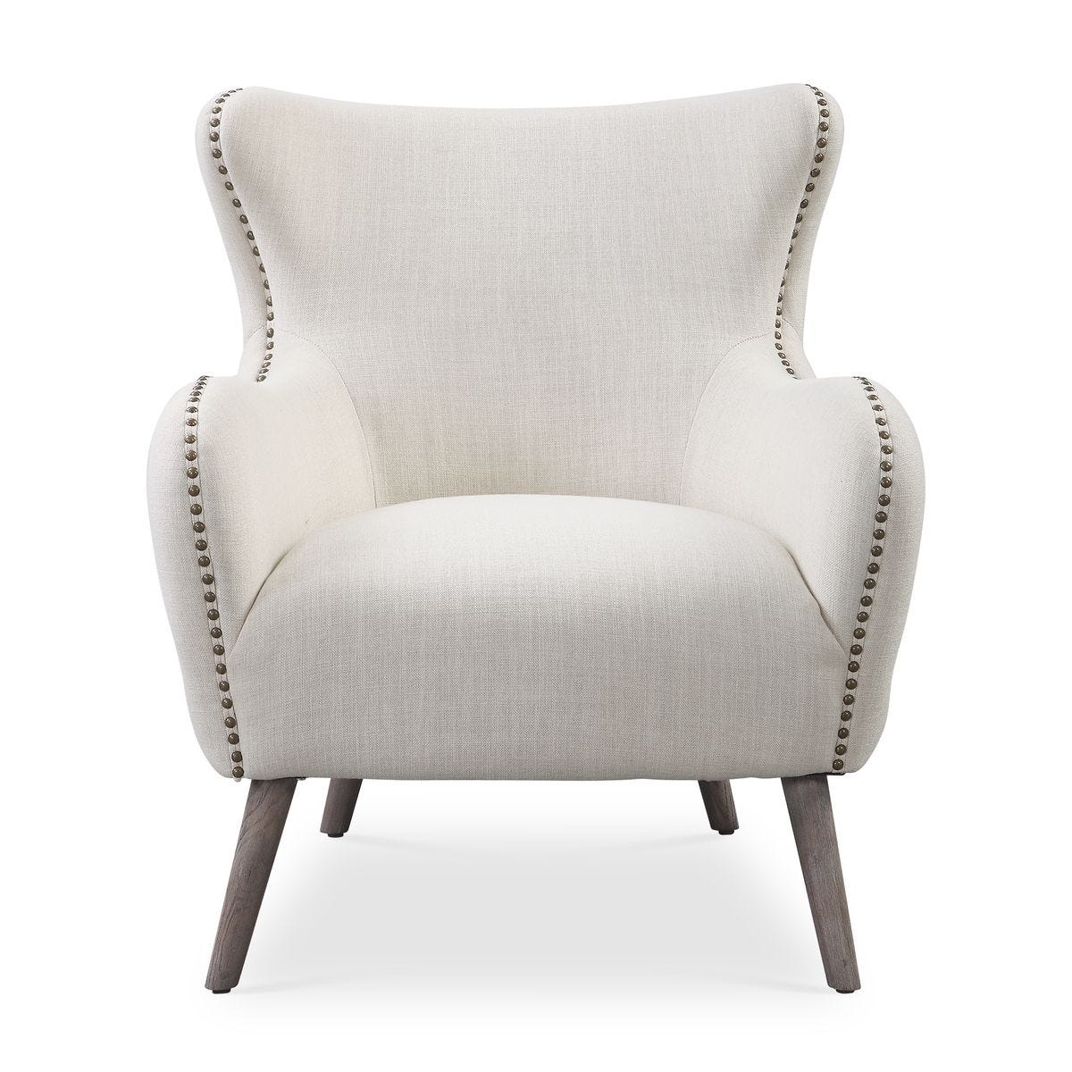 Beige armchair with nailhead trim on a white background