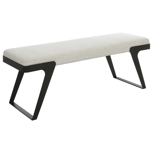 Bench with black legs and white cushion on a light wooden floor.
