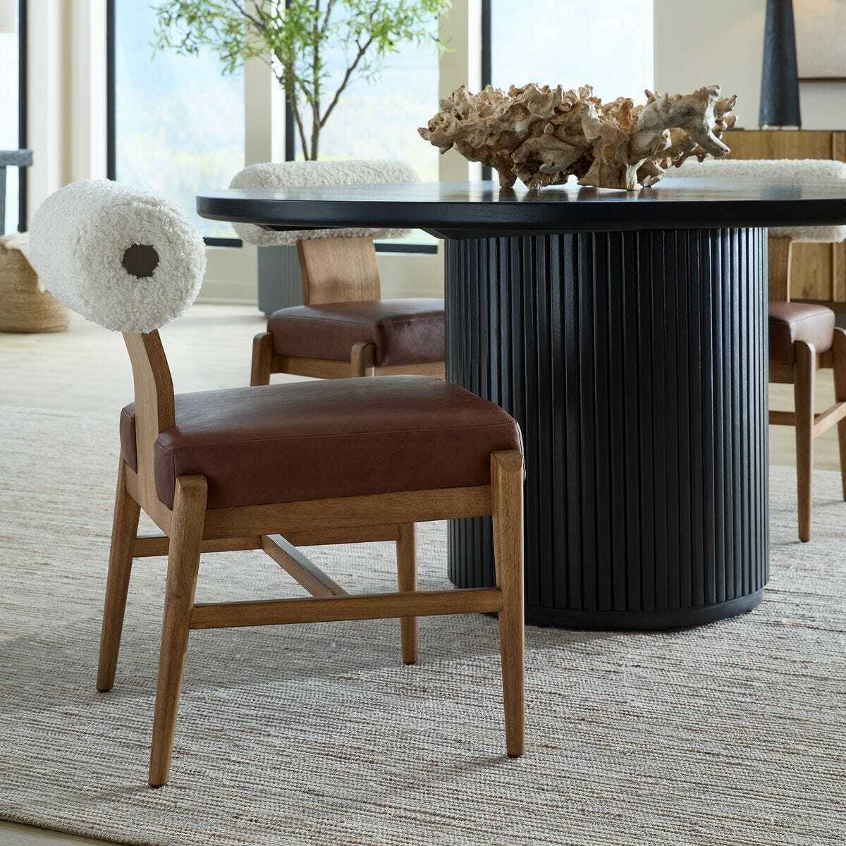 Wood and shear counter stool with leather cushion.