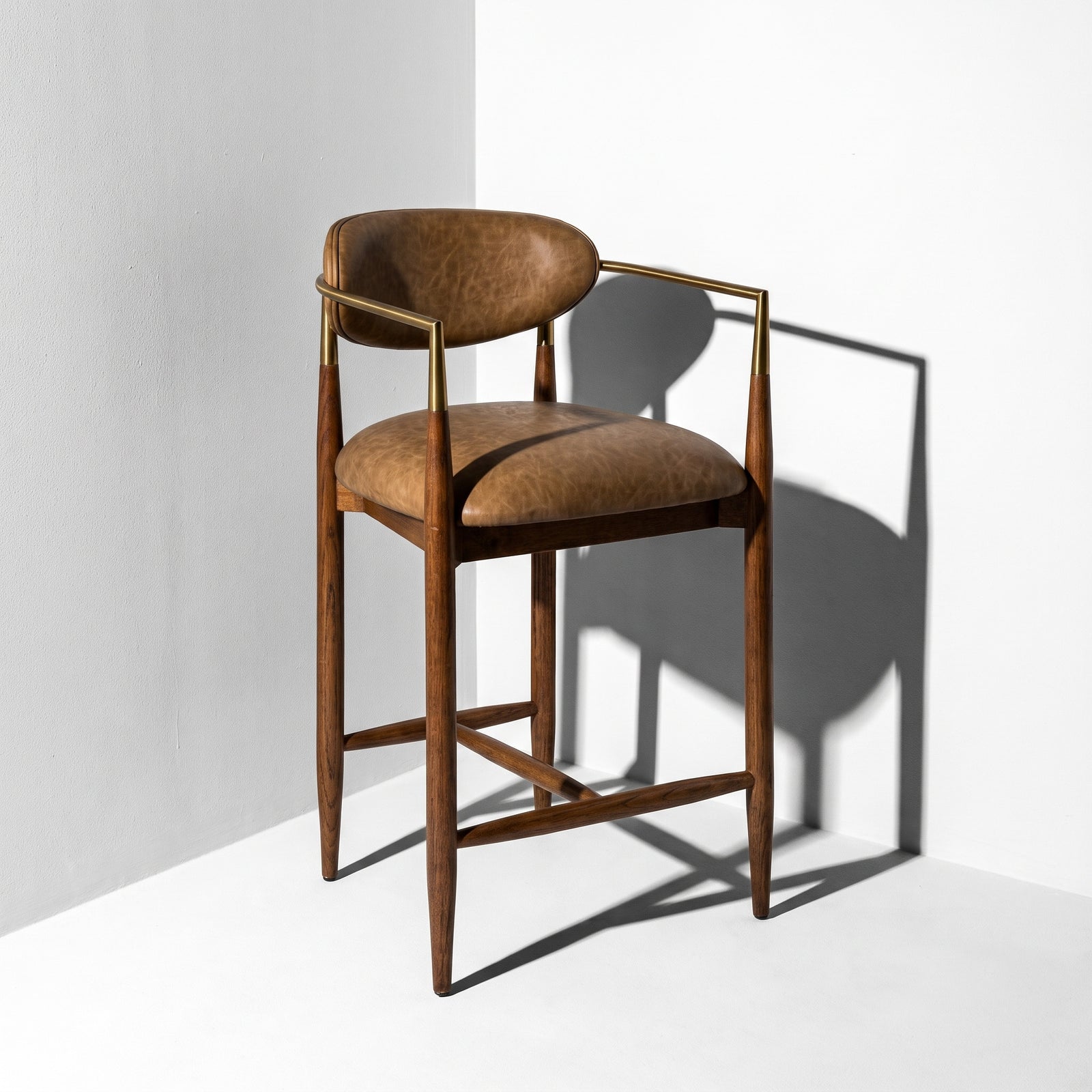 Walnut counter stools with arms and back.