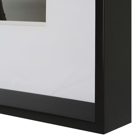 Black and white horse art above console.