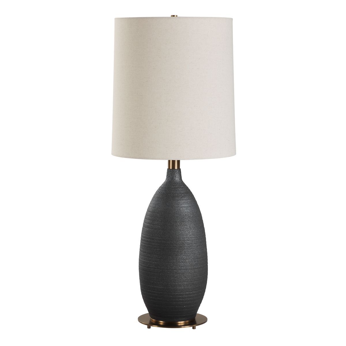 Table lamp with a dark gray base and beige lampshade on a white background