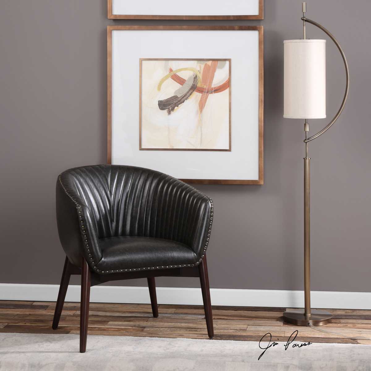Black faux leather accent chair.