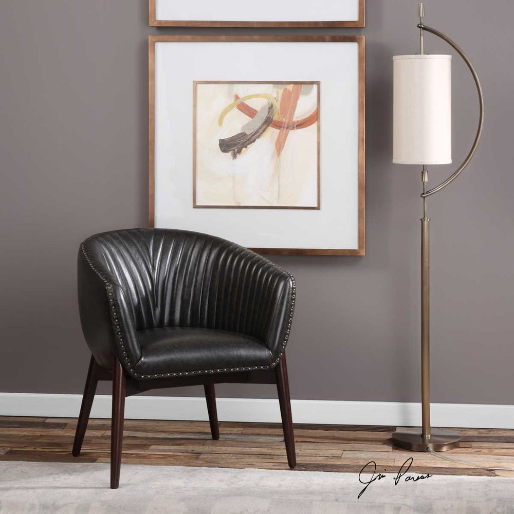 Black faux leather accent chair.
