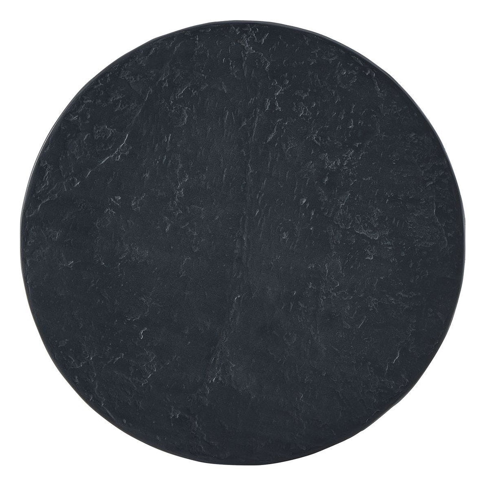 Round black stone coaster on a white background