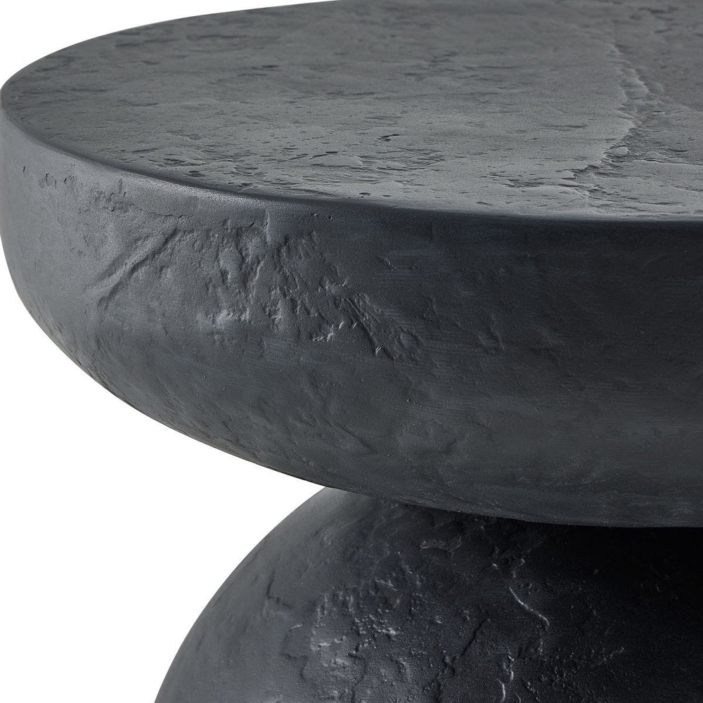 Dark gray textured round table on a white background
