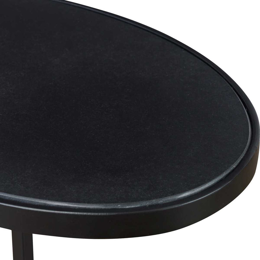 Round black table on a white background