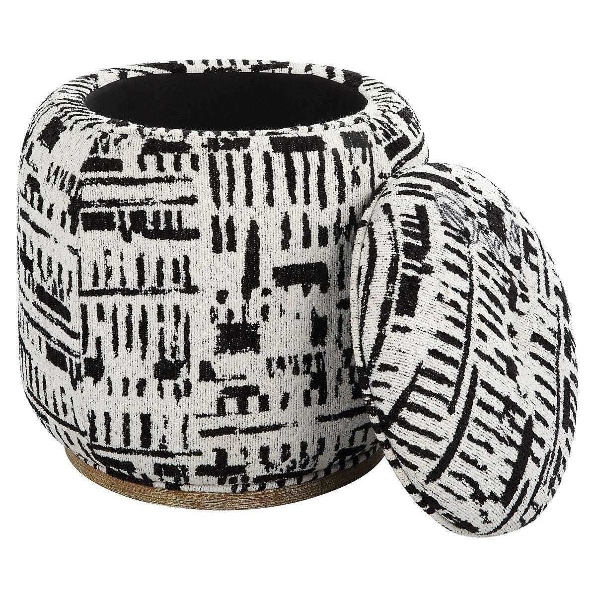 Black and white patterned ottoman with a cover on a white background