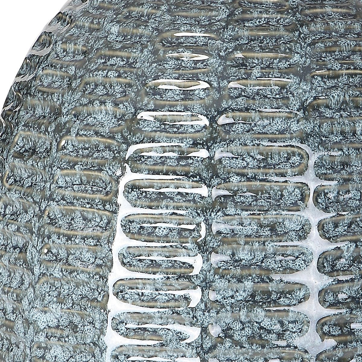 Close-up of a tire tread pattern with snow accumulation