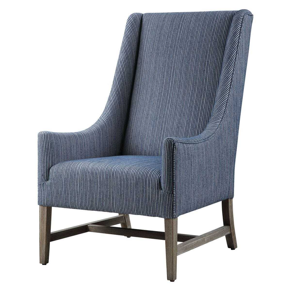 Blue upholstered armchair with wooden legs on a white background