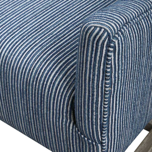 Blue upholstered armchair with wooden legs on a white background