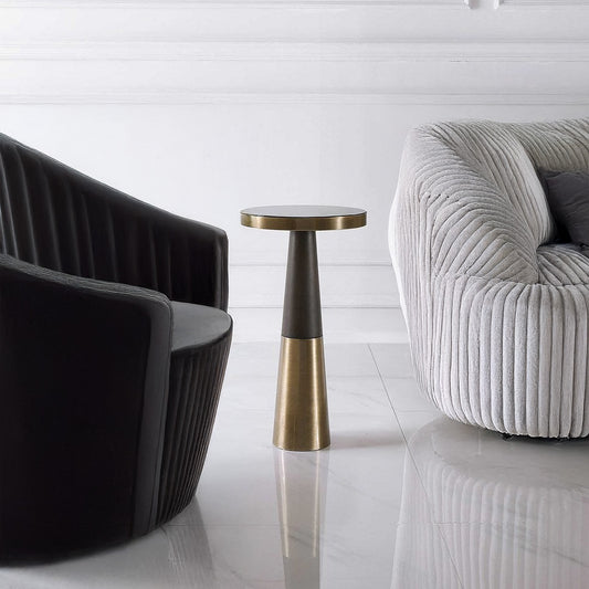 Modern Living Room with Brushed Brass Contemporary Round Drink Table next to decorative chair and sofa.