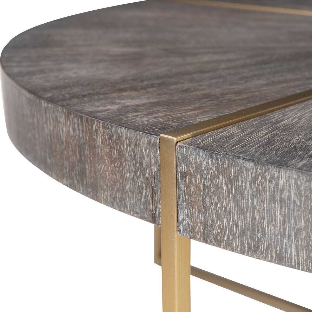 Round wooden table with gold metal legs on a white background