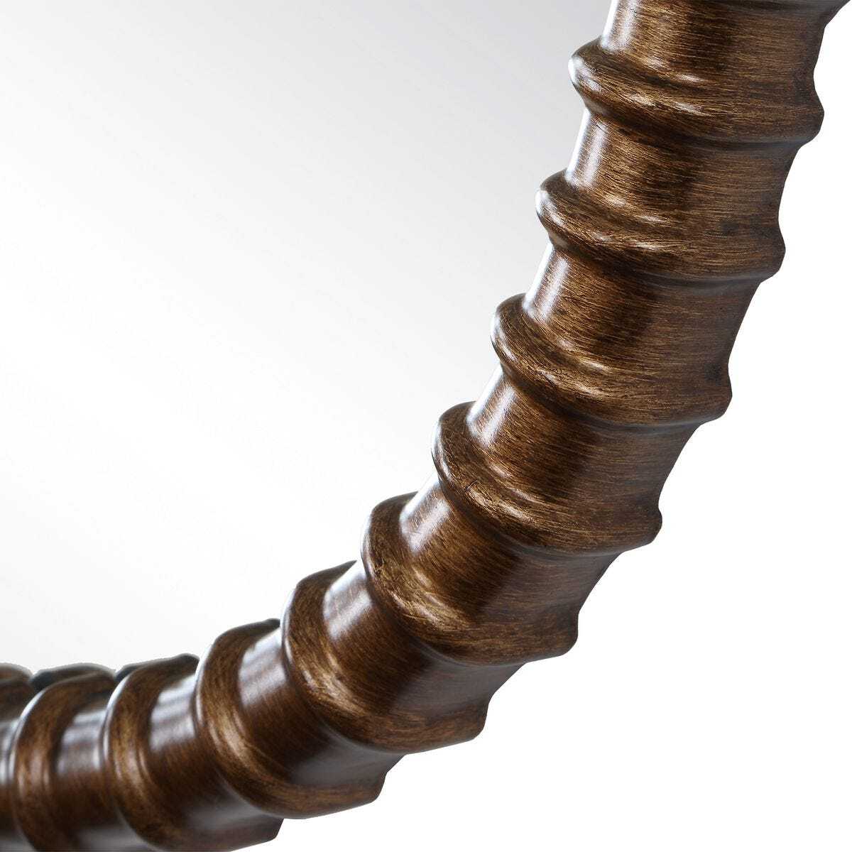 Close-up of a wooden spiral object on a white background