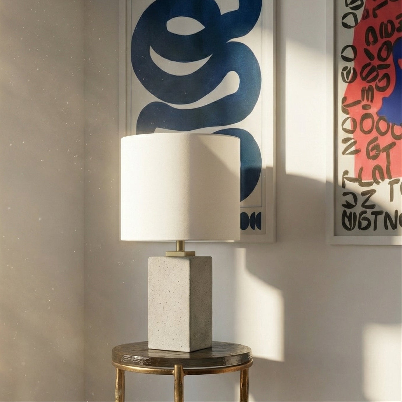 Brutalist Lamp on a small round table with abstract art on the wall