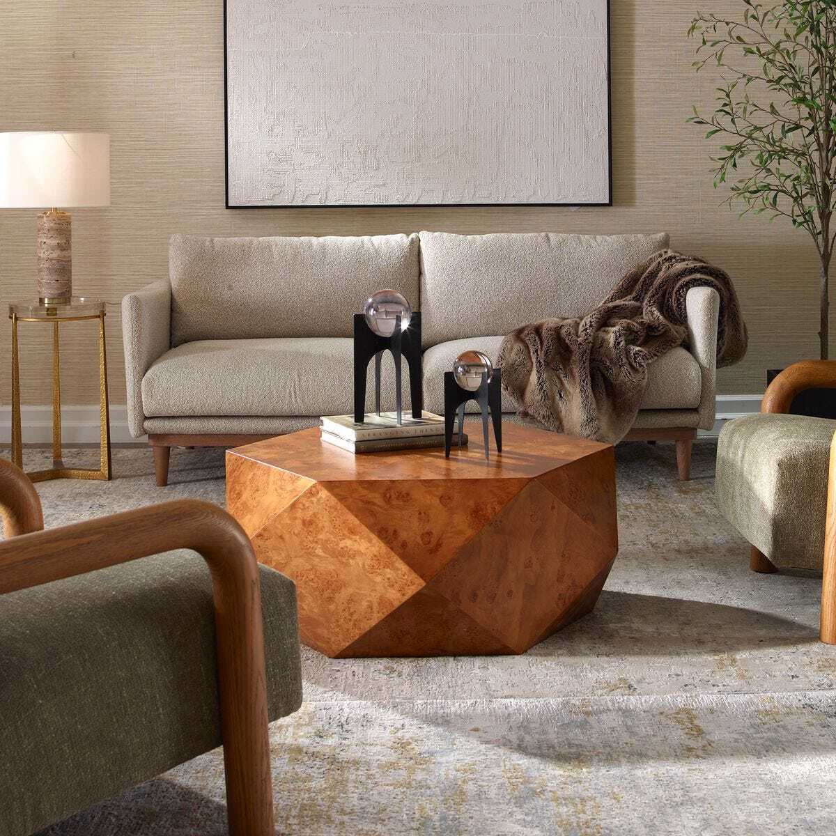 Modern living room with a geometric wooden coffee table and beige sofa.