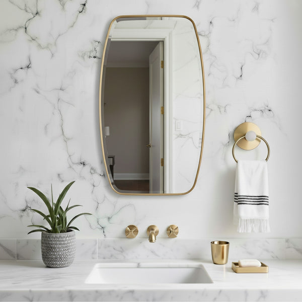 Bathroom with marble walls, gold fixtures, and a plant.