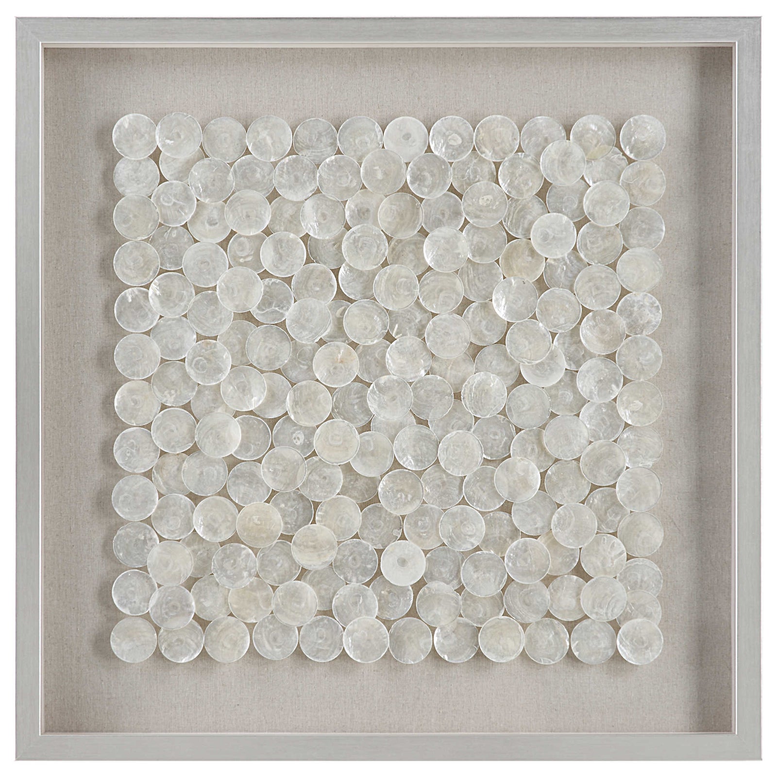 A shadow box style wall piece featuring natural layered capiz shells on a flax-toned linen backing, framed in pine wood with a brushed silver finish.