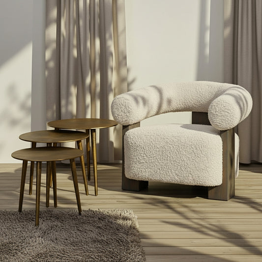 Beige armchair with wooden legs on a white background