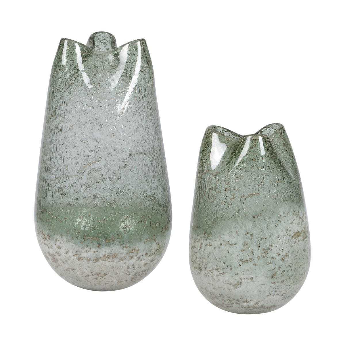 Two green glass vases with textured surface on a white background
