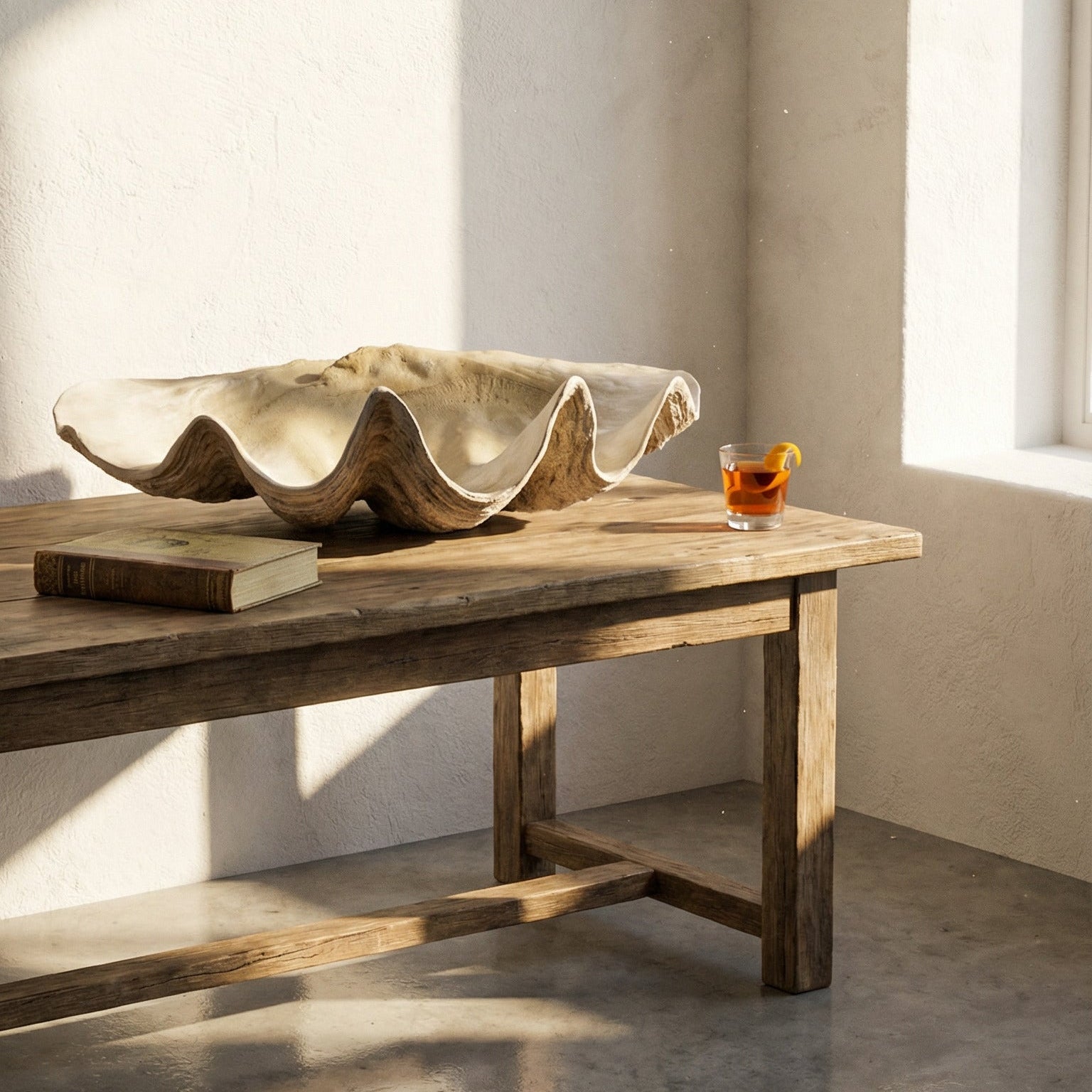 Large shell sculpture on a wooden table with a minimalistic background