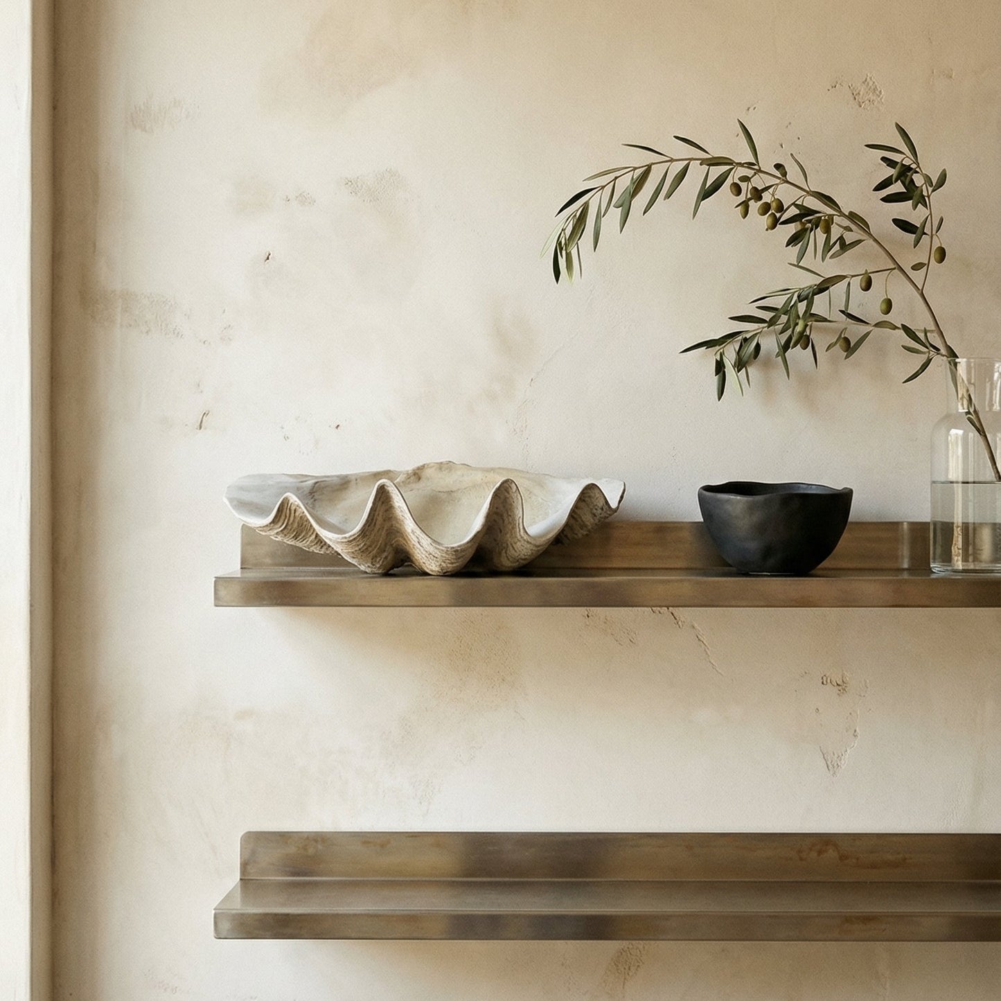 Shelves with decorative items against a beige wall