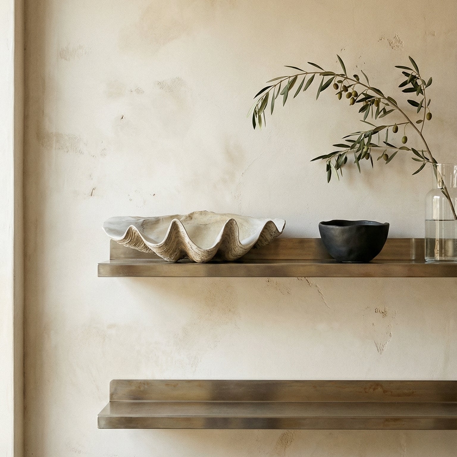Shelves with decorative items against a beige wall