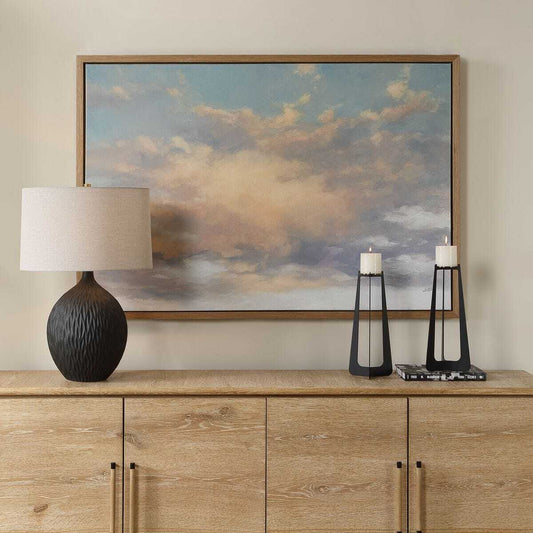 Framed artwork of a cloud painting on a white background
