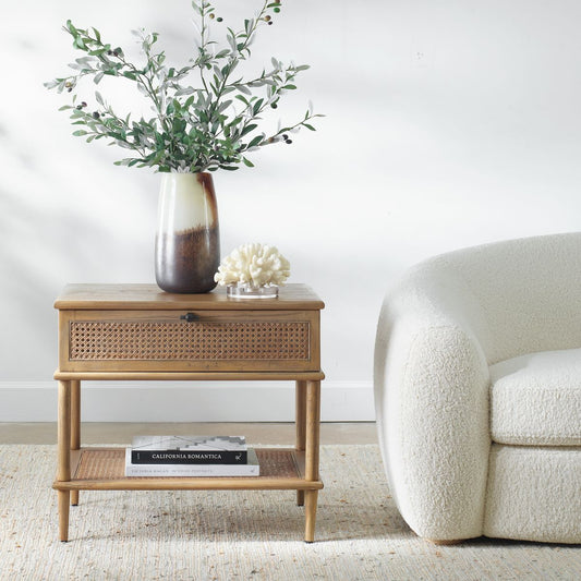 Coastal Accent Table in Loving Room with Designer Books and Boucle Sofa on White Rug.