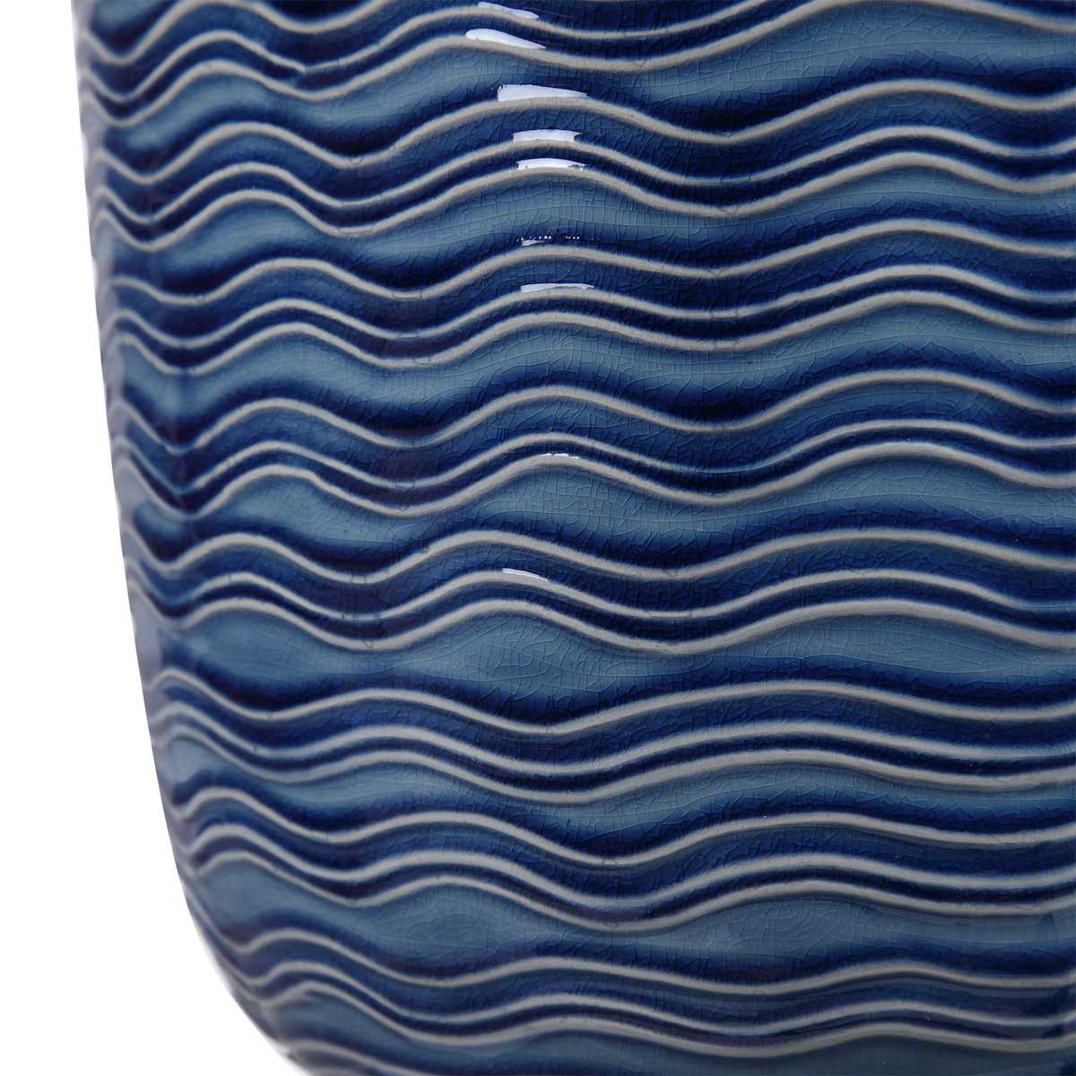 Close up of wavy ceramic blue texture of lamp.