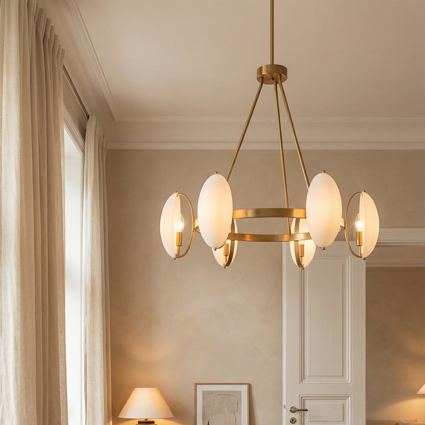 Modern office with wooden desk, chair, and brass modern chandelier.